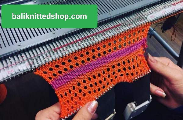 Women working on knitting machine in Bali knitwear factory